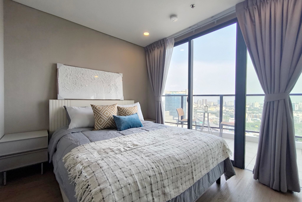 Modern 2-bed, 2-bath duplex condo at Siamese Rama 9. 65 sq.m on 17F, fully furnished. Just minutes to MRT Rama 9. Rent 55,000 THB/month. Ready to move in.