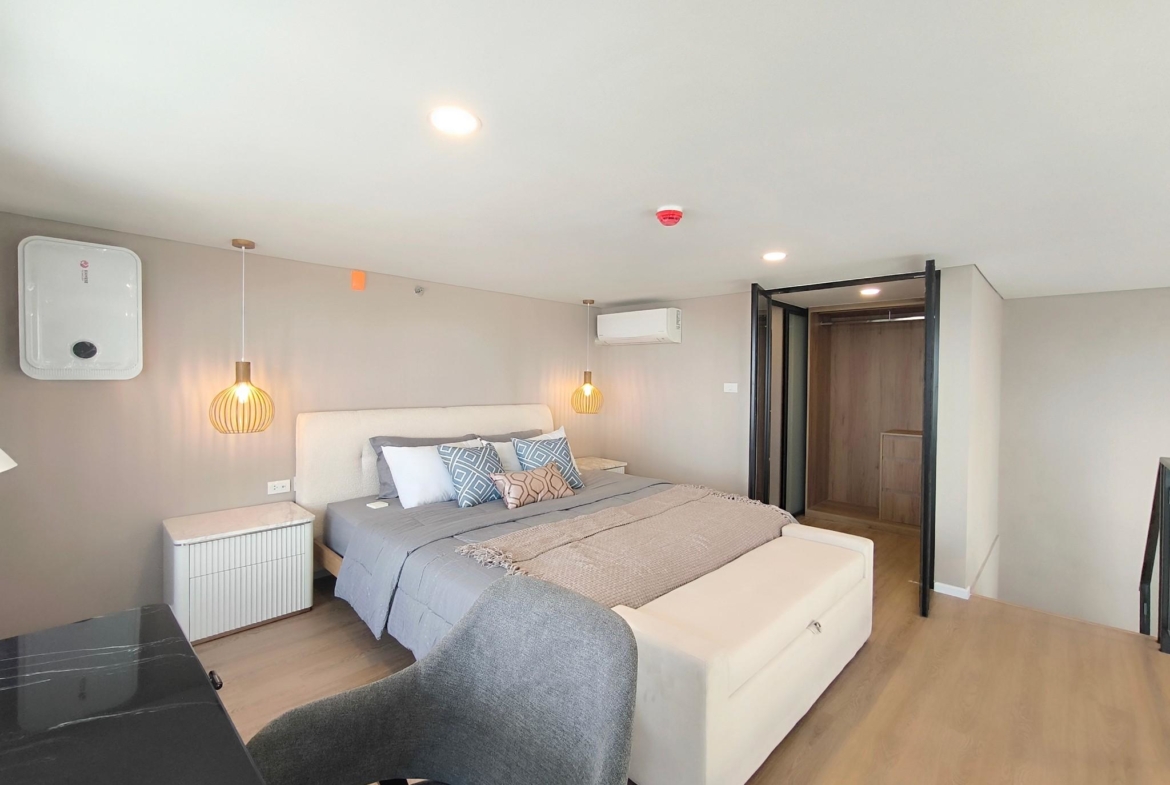 Modern 2-bed, 2-bath duplex condo at Siamese Rama 9. 65 sq.m on 17F, fully furnished. Just minutes to MRT Rama 9. Rent 55,000 THB/month. Ready to move in.