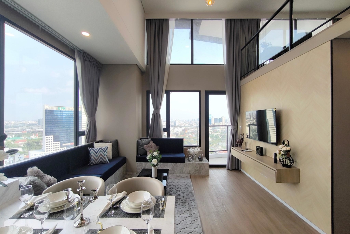 Modern 2-bed, 2-bath duplex condo at Siamese Rama 9. 65 sq.m on 17F, fully furnished. Just minutes to MRT Rama 9. Rent 55,000 THB/month. Ready to move in.