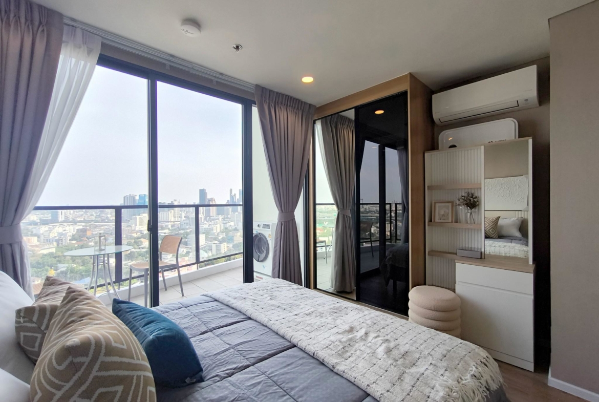 Modern 2-bed, 2-bath duplex condo at Siamese Rama 9. 65 sq.m on 17F, fully furnished. Just minutes to MRT Rama 9. Rent 55,000 THB/month. Ready to move in.