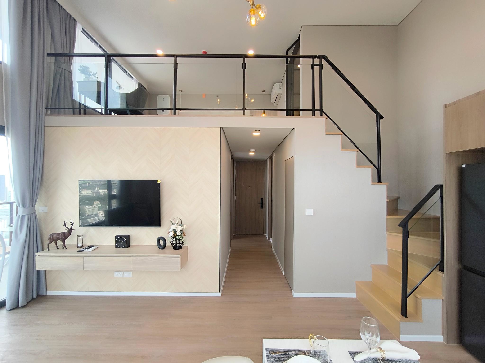 Modern 2-bed, 2-bath duplex condo at Siamese Rama 9. 65 sq.m on 17F, fully furnished. Just minutes to MRT Rama 9. Rent 55,000 THB/month. Ready to move in.