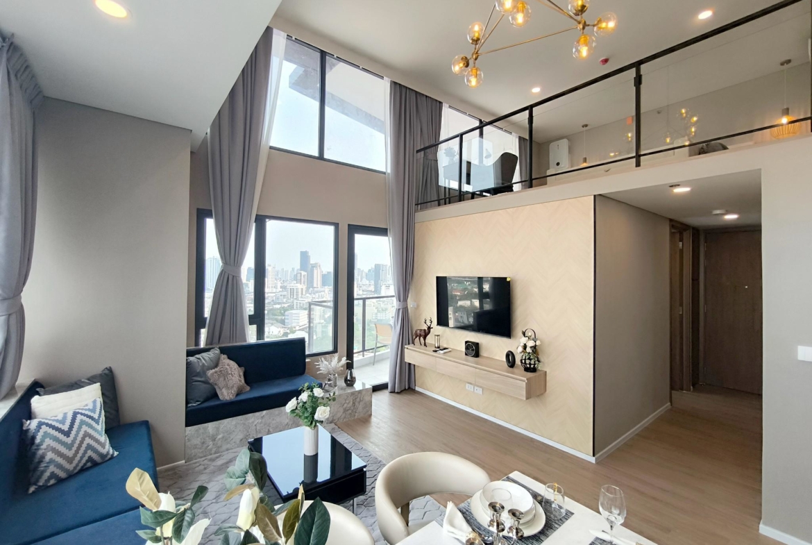 Modern 2-bed, 2-bath duplex condo at Siamese Rama 9. 65 sq.m on 17F, fully furnished. Just minutes to MRT Rama 9. Rent 55,000 THB/month. Ready to move in.