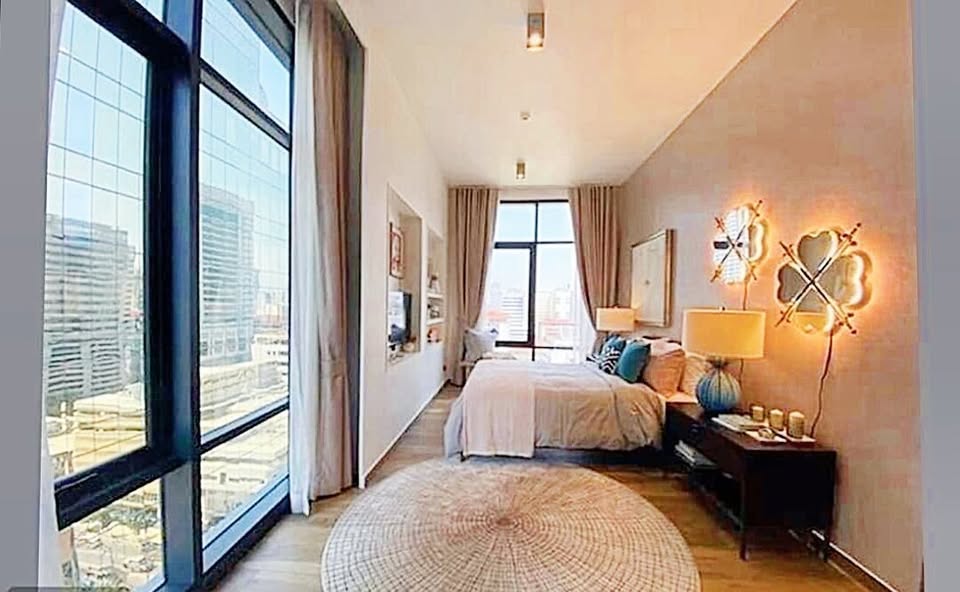 Stylish 2BR 2BA condo at The Lofts Asoke, 86 sqm, fully furnished, prime Sukhumvit location near MRT, BTS, Airport Link. Rent 80,000 THB/month.