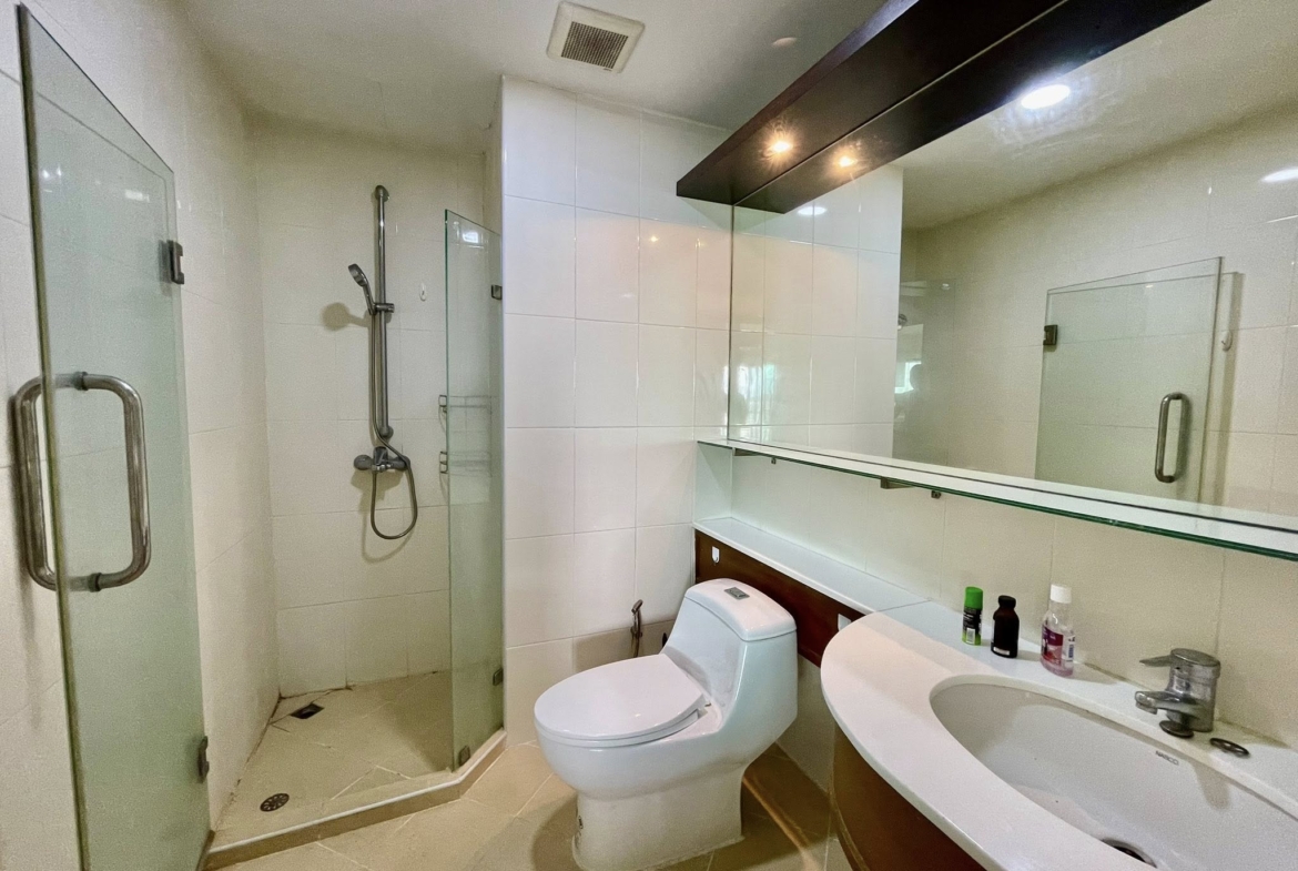 Spacious 2 bed condo at Sathorn Gardens, 94 sqm on 9th floor. Rent ฿40,000/month or buy for ฿11M. Walk to BTS, MRT, Silom & Lumpini Park.